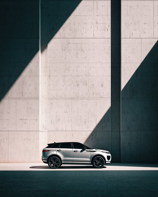 AP3 automotive visual — silver SUV against diagonal concrete light.